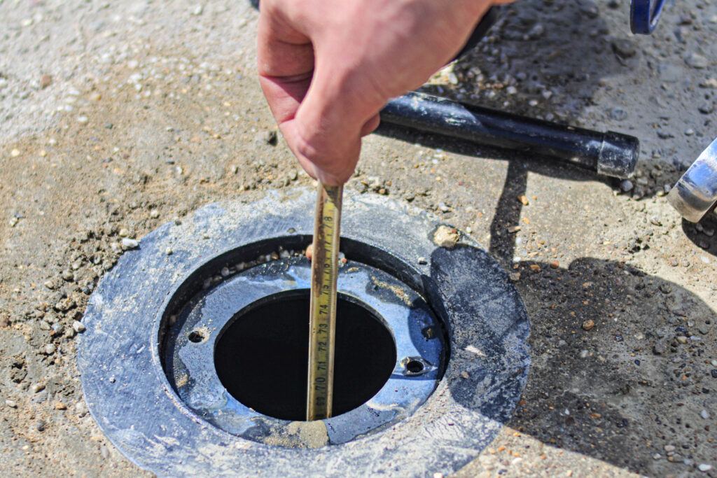 dipping groundwater levels at well with flush headworks